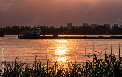 Obraz na plátne Sunset Serenity on Water sunset landscape water boat dock