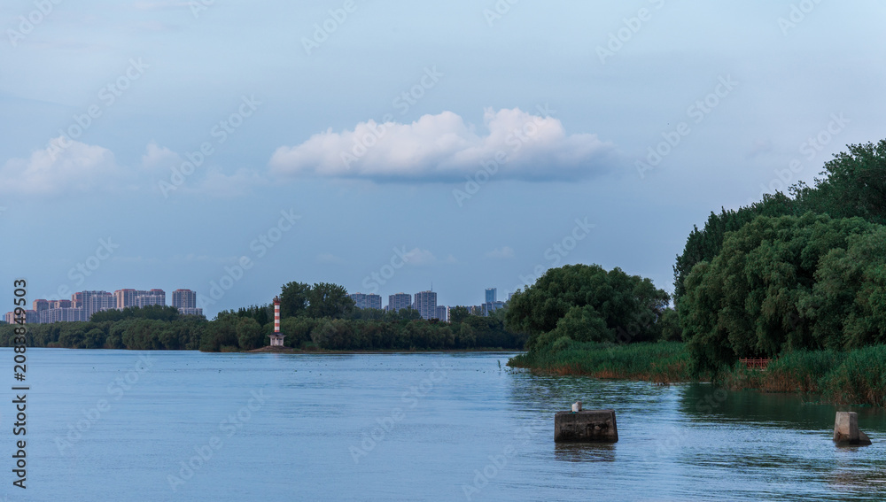 Fototapeta premium Tranquil River Scene river skyline calm modern urban