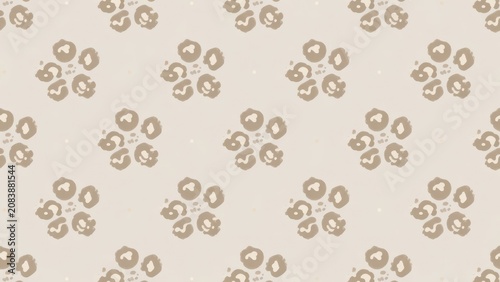 A repeated textile motif displaying soft brown organic leopard print shapes arranged in a symmetrical floral formation across a muted light tan surface creating an aesthetic organic nature textur