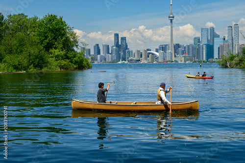 Photography Canoe paddlers on Toronto harbour skyline