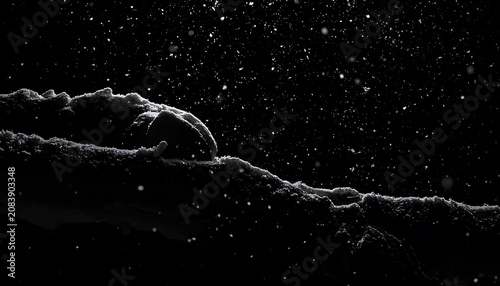Dark textured snow drift with falling snow, winter abstract, atmospheric winter background, high contrast, subtle light.