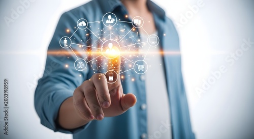 A person in a blue shirt interacting with a futuristic network of digital icons and connections