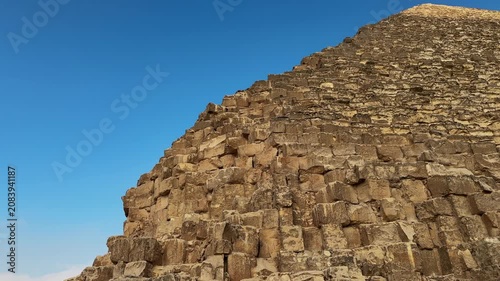 Close Up Tilt Motion Shot along the Limestone Block Masonry of the Great Pyramid of Khufu at Giza Necropolis