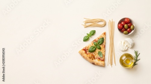 Italian food ingredients like pizza and pasta flat lay