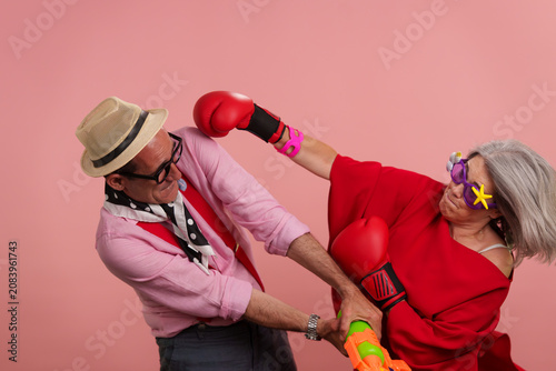 Older couple acting playful celebrating active maturity