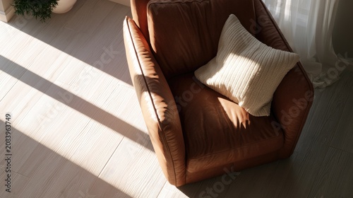 Cozy brown armchair bathed in warm sunlight with a soft pillow
