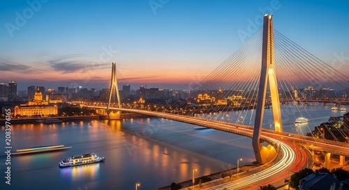 Modern Cable-Stayed Bridge Over River at Sunset.