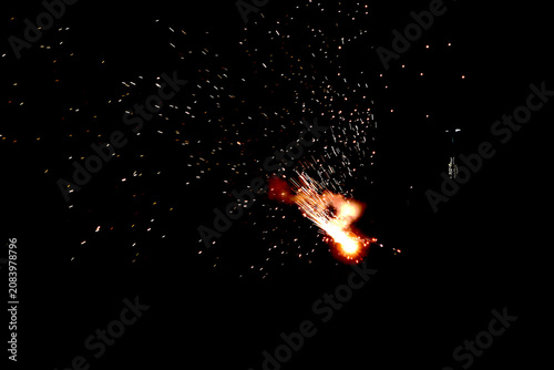 Firework Sparkler Burst – Bright Orange Yellow White Flames with Radiating Sparks Against Dark Night Sky Concept