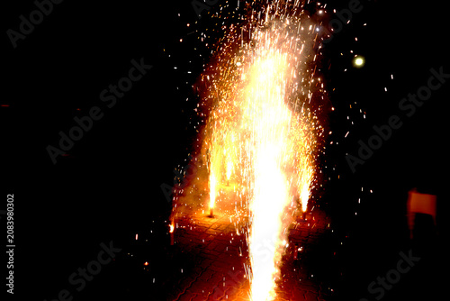 Ground Firework Fountains – Golden Sparks and Flames Rising Against Dark Night Sky Celebration Concept