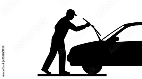 Silhouette of a man repairing car windshield wiper blade