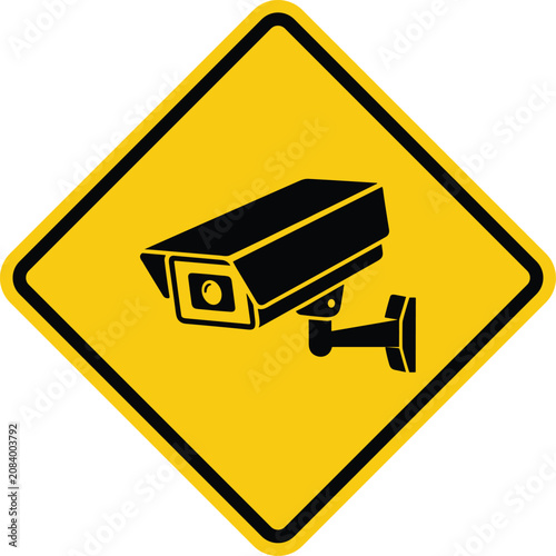 Yellow surveillance camera warning sign