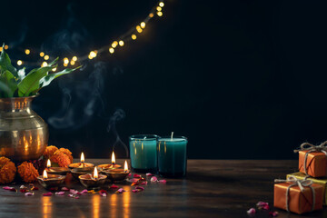 Diwali celebration background with burning oil lamps and gifts, traditional Indian festival of lights scene, glowing diya candles on wooden table