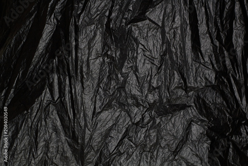 crumpled black plastic background
