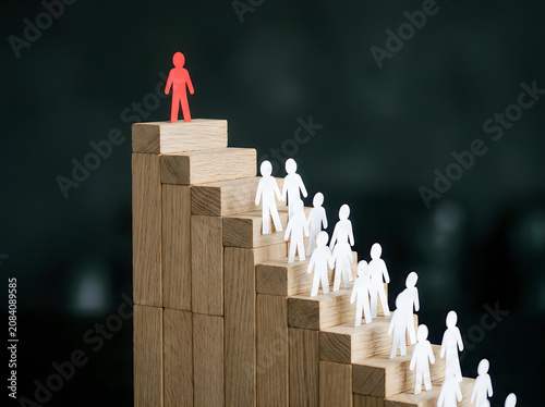 Person climbing success staircase with others