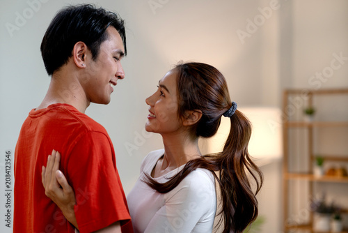 Happy Smiling Couple Bonds Together In Comfortable Home Setting
