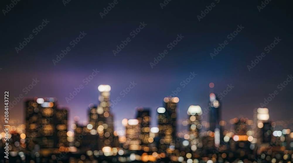 Obraz premium Abstract bokeh background of blurred city lights at night with copy space.