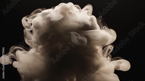 Isolated white smoke explosion on black background.