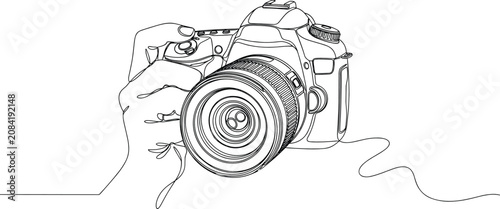 Photos Camera held by hand continuous line art drawing with single line minimalist photo camera body and professional lens graphic element