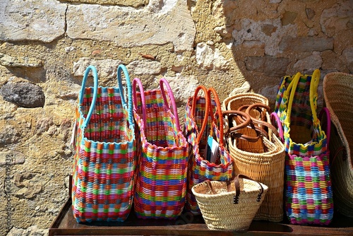 фотографія Colorful artisan baskets on display in the picturesque village of Lacoste in Provence-Alpes-Côte d'Azur Vaucluse, France