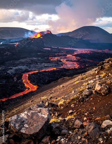 Fiery Lava Flow Descends Volcanic Mountain Under Dramatic Sky.