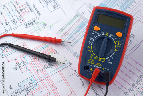 The digital multimeter electrical engineering drawings, circuit breaker and pencils