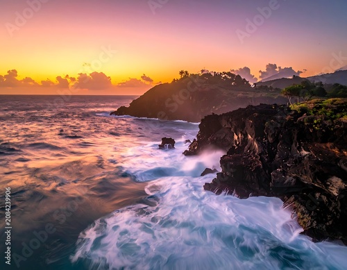 Ocean waves crash against rocky coastline at sunset