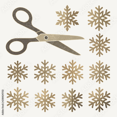 Fotografie Vintage scissors cutting paper snowflakes on a cream background