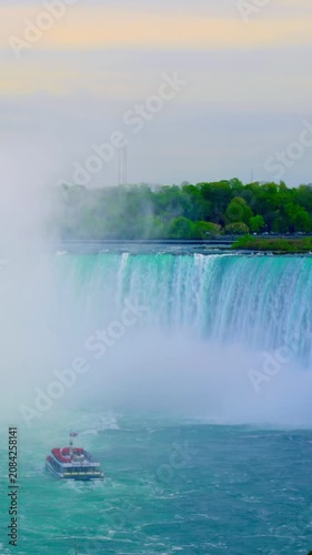 Calm dawn landscape. Serene morning with flowing waterfalls. Peaceful sunrise over misty waterfalls and wildlife. Tranquil dawn scene featuring waterfalls and vibrant wildlife activity