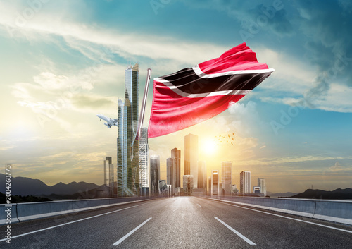 Fotografie Trinidad and Tobago national flag waving with modern and developed landscape