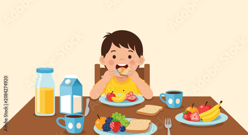 Happy young boy eating a delicious breakfast with fruit and toast at a table