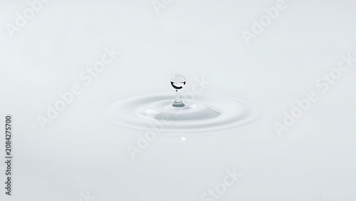 Single water droplet rolls across a smooth glossy resin surface, leaving a clear trail.