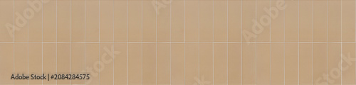 Caramel ceramic finger tiles arranged vertically in a seamless modern wall pattern.