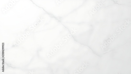 Polished white marble surface with subtle veining patterns, clean minimalist background, smooth texture with natural stone variations.