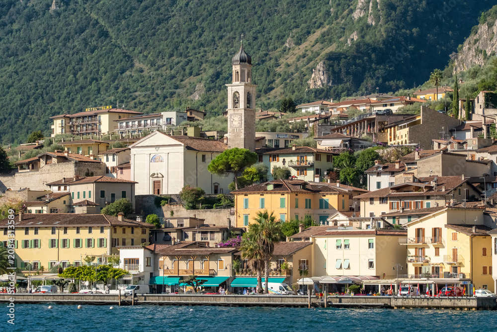 Fototapeta premium Old town harbor and lakefront view, Limone sul Garda, Italy