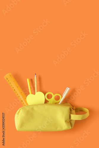Yellow pencil case with dif...