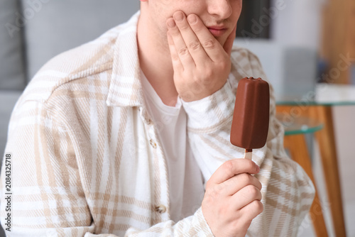 Young man with ice-cream su...