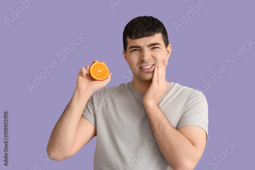 Young man with orange suffe...