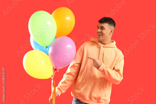 Young man with bunch of col...
