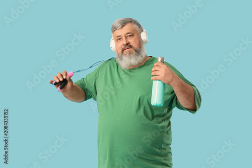 Overweight mature man in he...