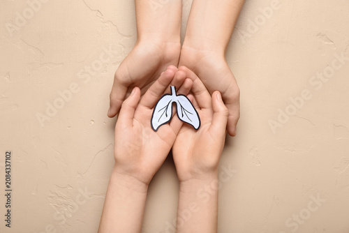 Hands of woman and child wi...