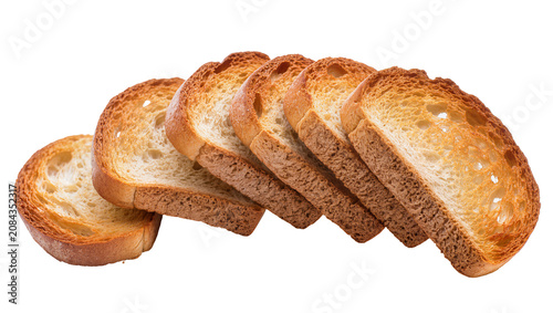 Fotografie Isolated crispy golden brown toasted bread slices, crunchy rusks for breakfast o