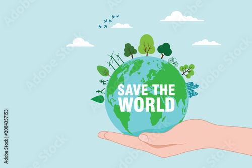 Hand holding a green Earth with trees, wind turbines, bicycle, and 