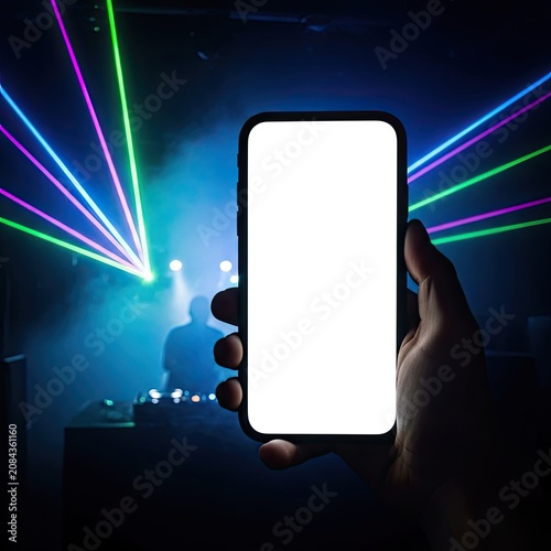 Hand Holding Smartphone with Blank White Screen in Nightclub Party with Laser Light Show and DJ Background