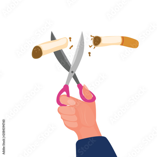 Foto Hand cutting cigarette using scissors