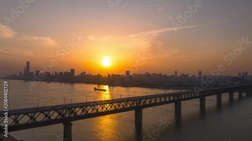 Aerial Timelapse Panorama of Wuhan City Skyline at Sunrise, Yangtze River and Wuhan Yangtze River Bridge at Dawn, Hubei China
