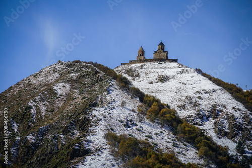 Canvastavla Gergeti Trinity Church Perched on Snowy Mount Kazbegi in Stepantsminda, Georgia