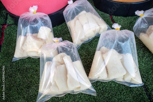 Sweet fermented cassava tapai portions on display at a local market stall
