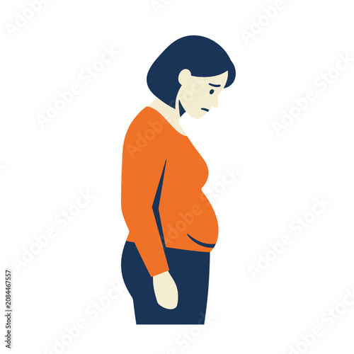 A sad woman looks down at her bloated belly in disappointment