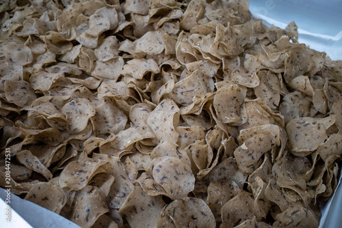 Uncooked keropok keping traditional Malaysian dried fish crackers close up