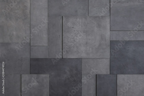 Dark grey geometric concrete wall texture background